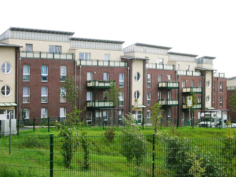 Bild vergrößern: Wohnanlage mit mehrstckigen Mehrfamilienhusern.