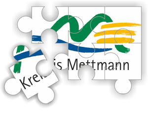 Bild vergrößern: Auf Puzzlestücken ist das Kreislogo abgebildet.